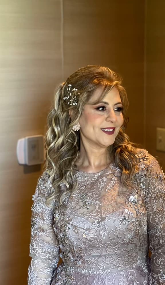 Balayage highlights with side-swept curls for a special occasion at R&M Salon