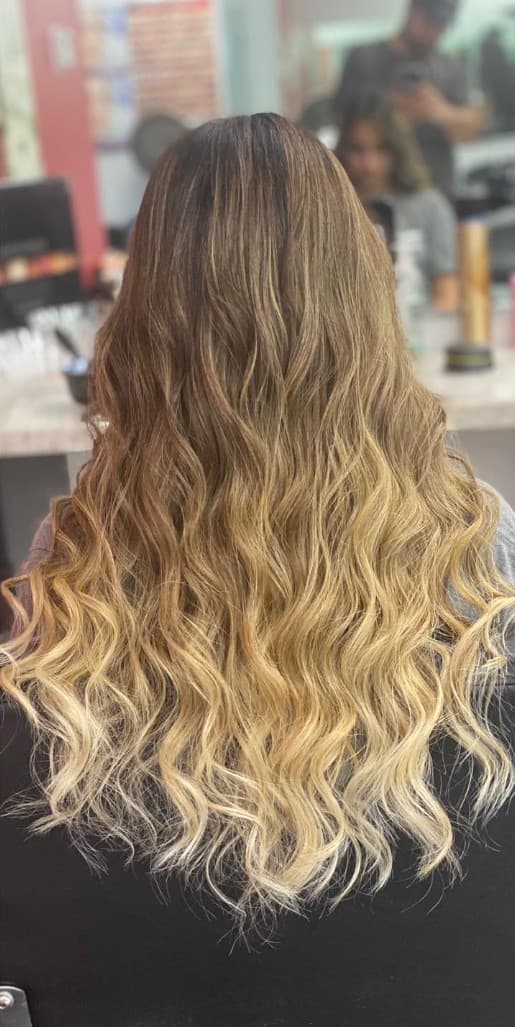 Golden balayage waves back view at R&M Salon in Smyrna