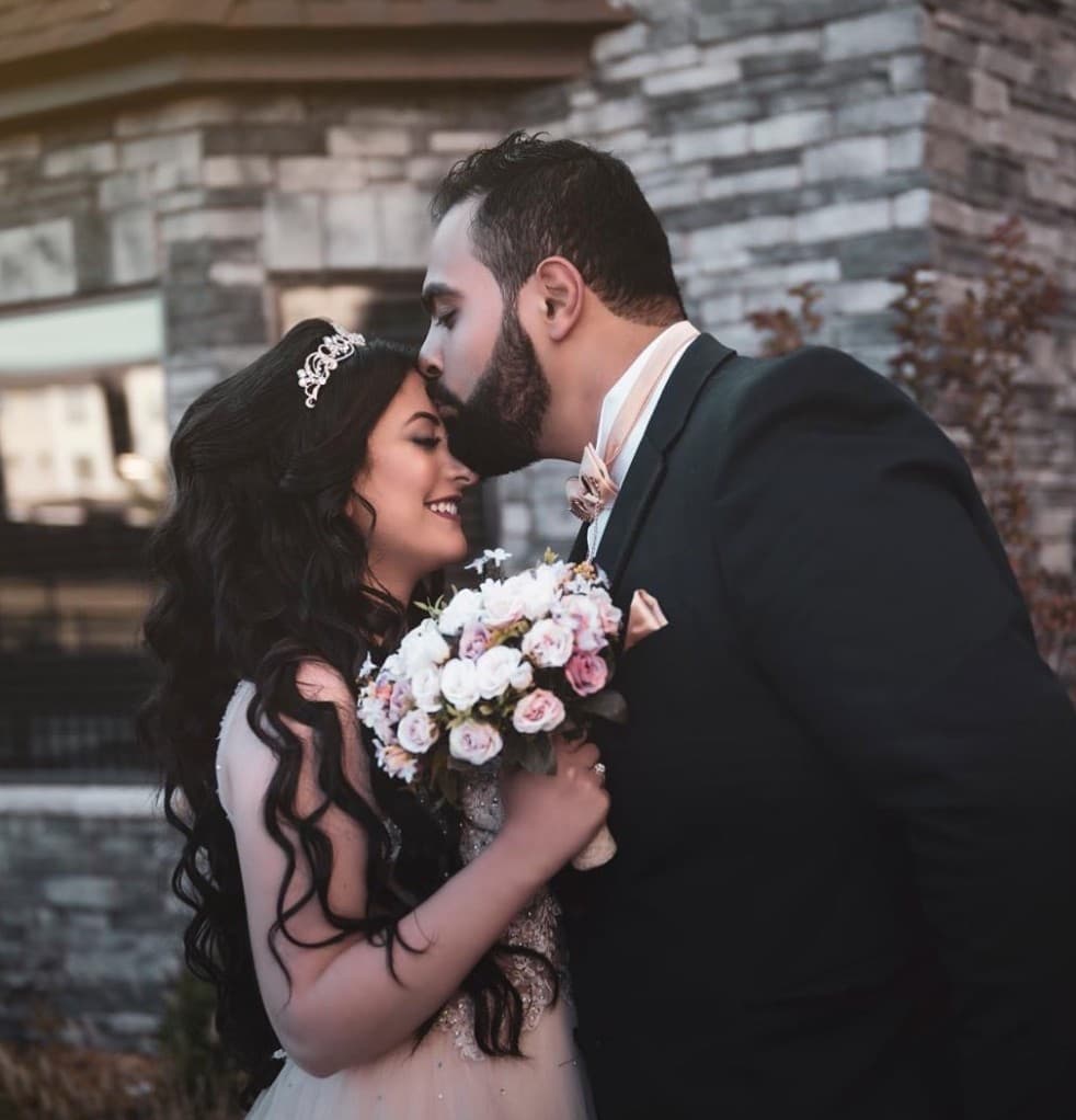 Bride and groom wedding portrait with bridal hairstyle by R&M Salon