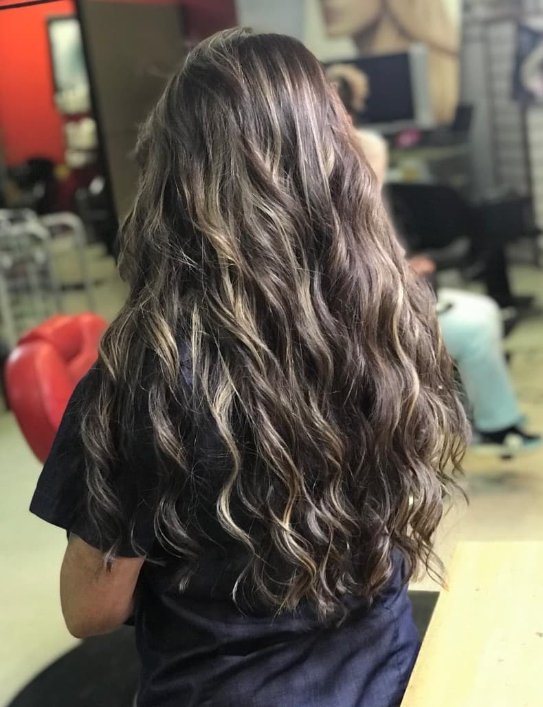 Long balayage waves with natural highlights back view at R&M Salon